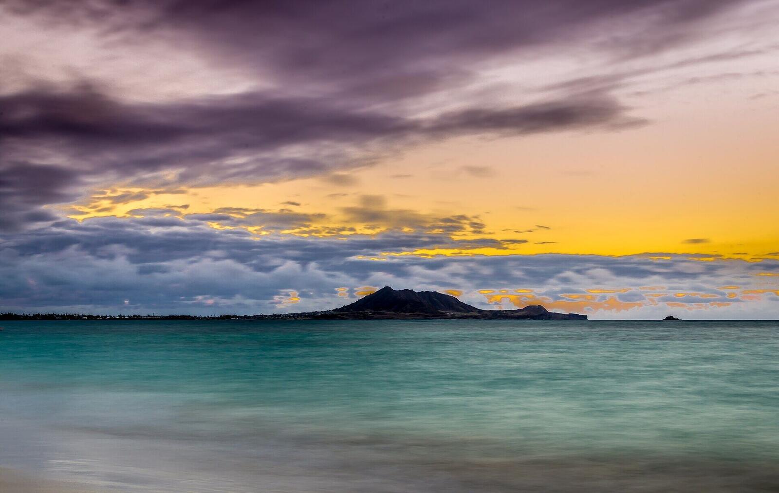 First light over the water at Kailua Beach with Popoia island on the horizon